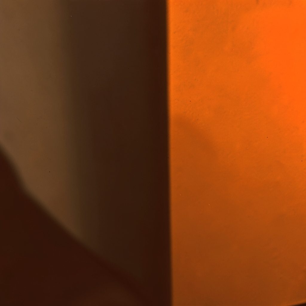 A dark abstract digital composition with glowing orange and amber geometric patterns, evoking a technical software mood.